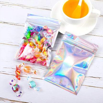 100 Pieces Resealable Foil Proof Bags Scent Proof Flat Pouch Clear Smell Sealable Packing Bags Iridescent for Food Storage Snack Jewelry(3 X 4 Inches,Holographic Color)